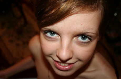 Cute amateur ginger Simona posing naked and spreading her pussy