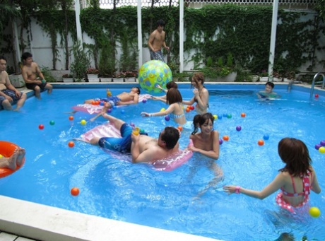 Frisky Japanese babes wank, blow and fuck tiny Asian cocks at the pool party