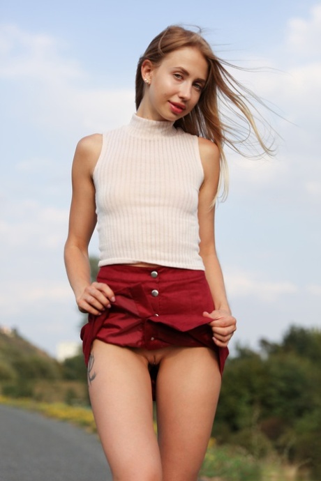 Skinny girlfriend Anna Di teases with her cute ass and shaved cunt outdoors