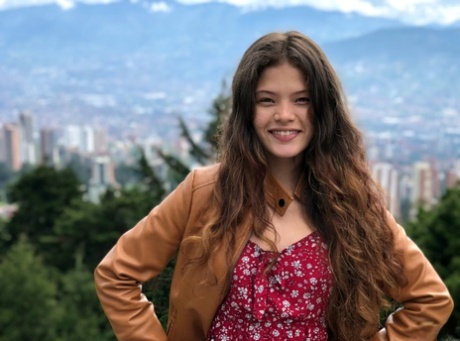Playful Latina teen Irene Rouse poses naked and in her sexy outfits