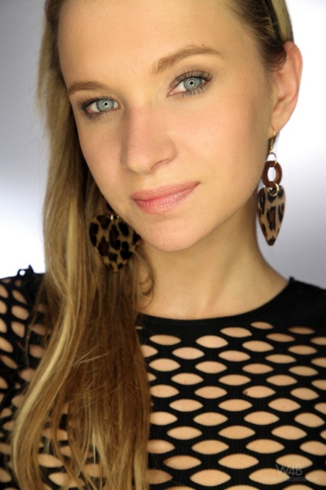 Cute blue eyed teen Angel Piaff reveals her hot body and plays with sour cream