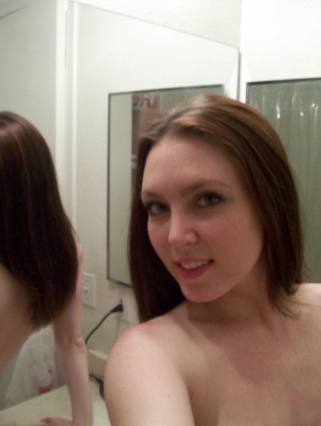 Sweet amateur teen takes selfies of her big tits, bald pussy and round booty