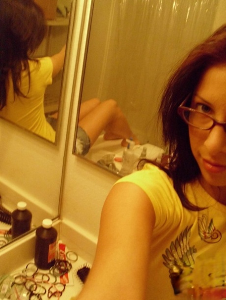 Nerdy teen babe Cydella Stones teases with her big tits in a solo