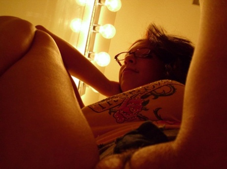 Nerdy teen babe Cydella Stones teases with her big tits in a solo