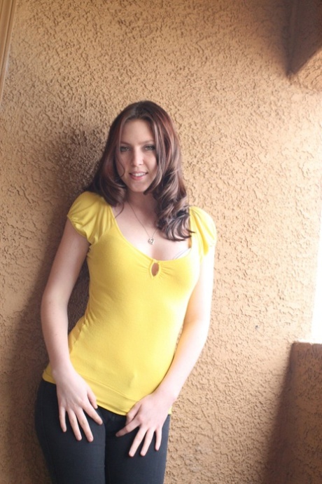 Brunette teen Megan Loxx strips off her leggings and shows her big booty