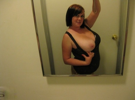 Chubby amateur teen Jessica Claire shows her big tits and poses in the mirror