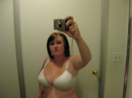 Chubby amateur teen Jessica Claire shows her big tits and poses in the mirror