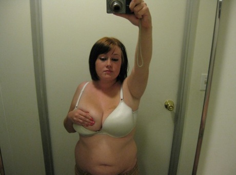 Chubby amateur teen Jessica Claire shows her big tits and poses in the mirror