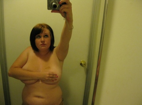 Chubby amateur teen Jessica Claire shows her big tits and poses in the mirror