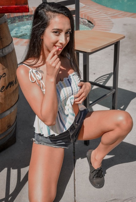 Brunette doll Kiarra Kai flaunts her big booty poolside & massages a dick