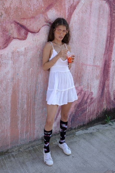 Colombian hottie Irene Rouse poses in her sexy white dress in public