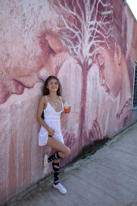 Colombian hottie Irene Rouse poses in her sexy white dress in public