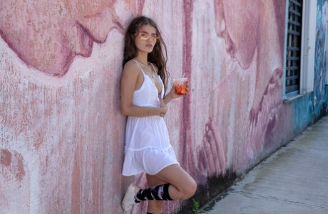 Colombian hottie Irene Rouse poses in her sexy white dress in public