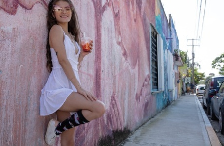 Colombian hottie Irene Rouse poses in her sexy white dress in public