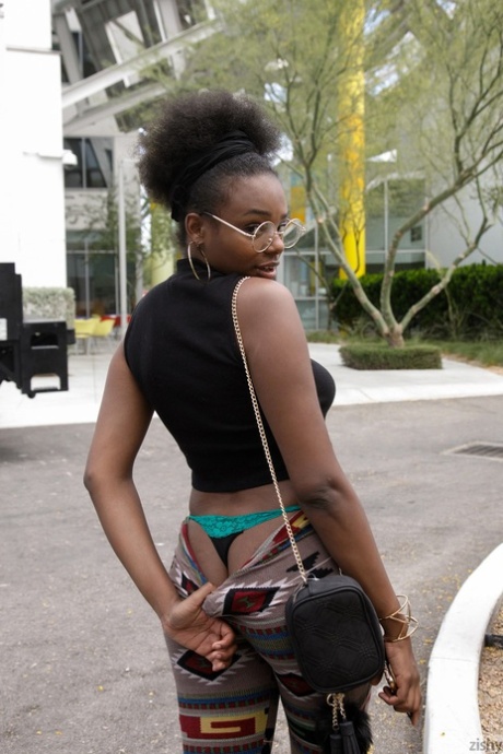 Naughty ebony babe Neda Marie exposes her natural tits & her hot ass in public