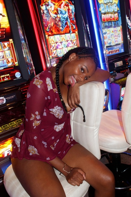 Naughty ebony babe Neda Marie exposes her natural tits & her hot ass in public