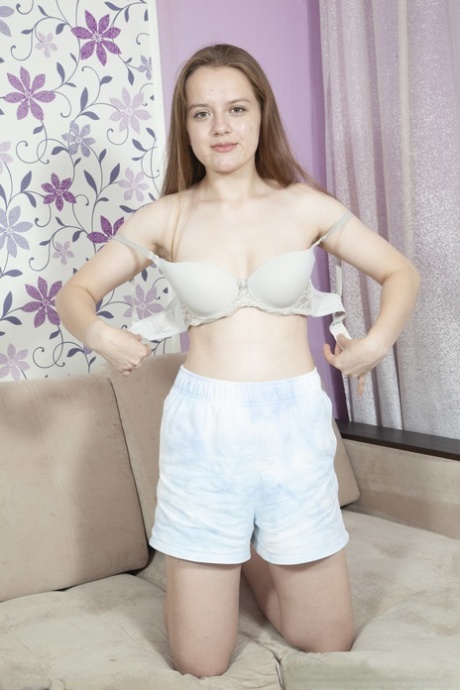 Petite Russian babe Vieta Angel unveils her big perky tits and toys her muff