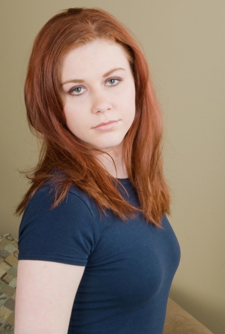 Redheaded teen amateur Mickey strips down naked and gently fingers herself
