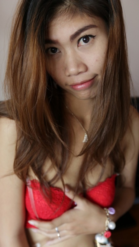 Asian babe Nam C shows off her petite body while stripping for some POV sex
