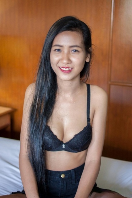 Pretty Asian babe Pop shows her creampied pussy after a hot striptease