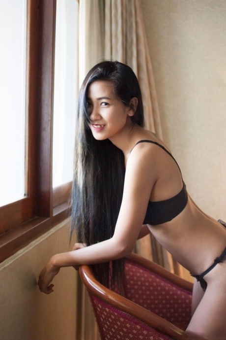 Pretty Asian babe Pop shows her creampied pussy after a hot striptease