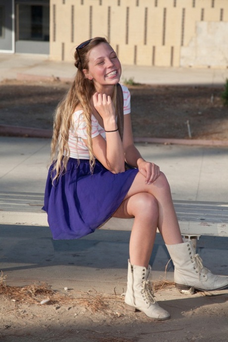 Hot college teen with sexy thighs Marley Kunis flashing an upskirt in public