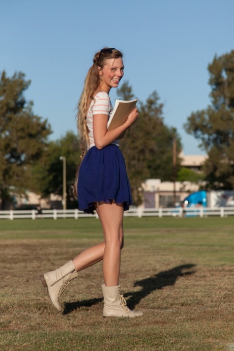 Hot college teen with sexy thighs Marley Kunis flashing an upskirt in public