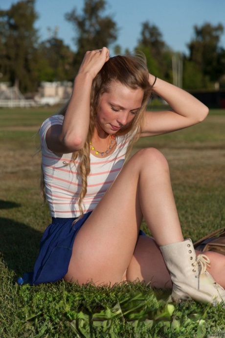 Hot college teen with sexy thighs Marley Kunis flashing an upskirt in public
