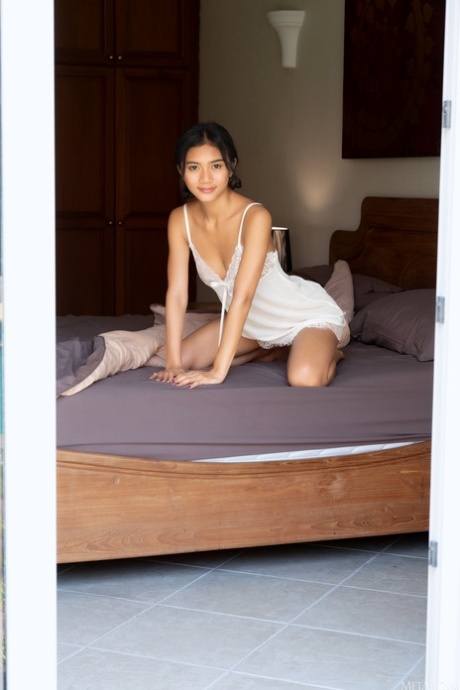 Adorable Asian teen Yori reveals her slender figure and poses naked