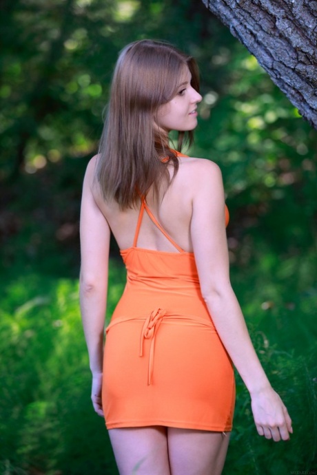Barely legal teen Libby gets naked in beautiful nature & spreads her pussy
